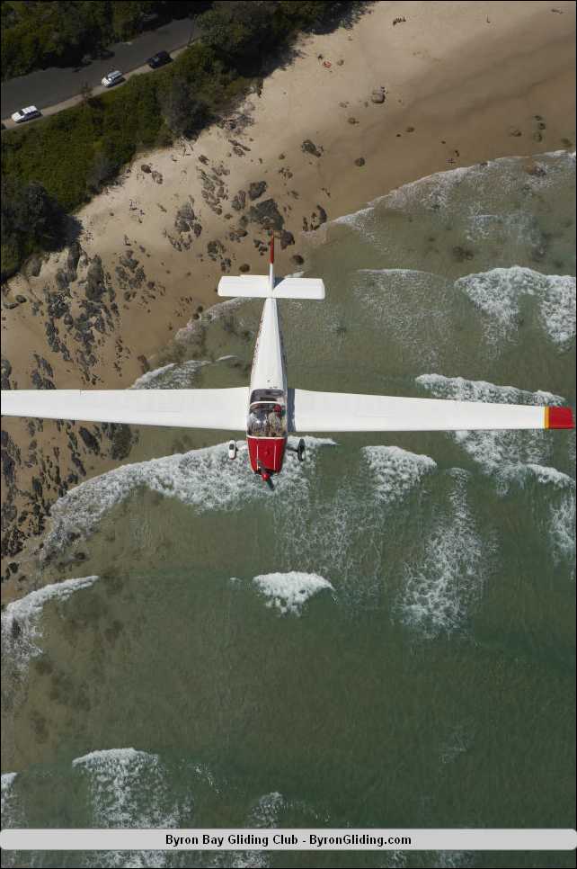 Motor Falke Glider flying over Watego Beach.jpg